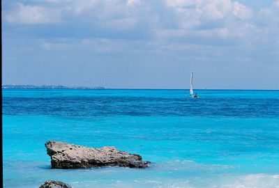 Scenic view of sea against blue sky