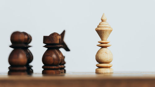 Close-up of chess pieces on table