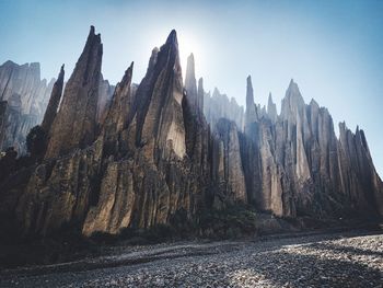 Panoramic view of rock formations against sky