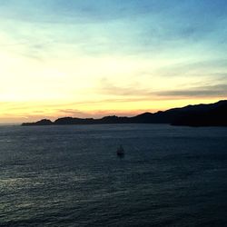 Scenic view of sea at sunset