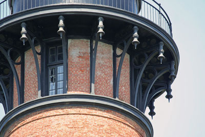 Low angle view of street light against building