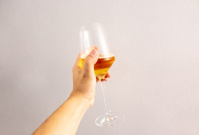 Midsection of woman drinking glass