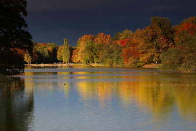 Reflection of trees in lake against sky