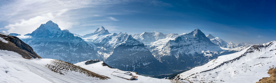 Scenic view of snowcapped mountains against sky