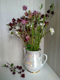 Flower vase on table