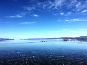 Scenic view of sea against blue sky