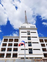 Low angle view of building against cloudy sky