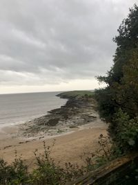 Scenic view of beach against sky