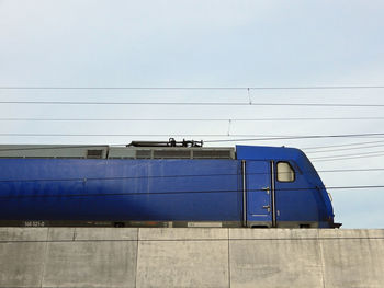 Low angle view of railroad engine against clear sky