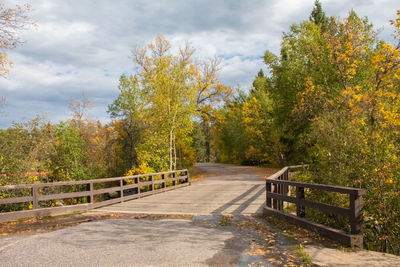 Scenic view of autumn trees against sky