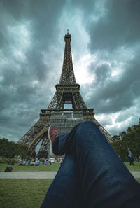 Low angle view of tower against cloudy sky