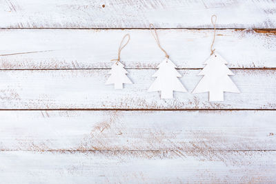White wall hanging on wood