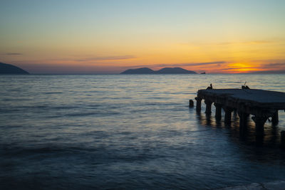 Scenic view of sea against sky during sunset