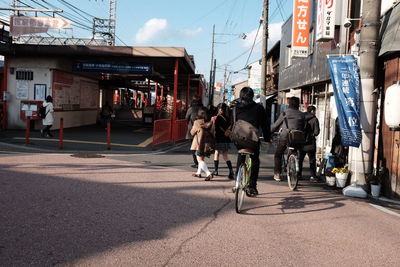 People walking on road in city