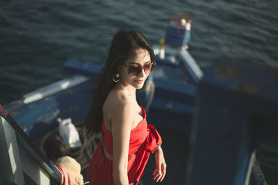 Young woman in boat at sea