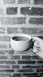 Close-up of hand holding cup