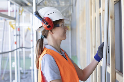 Young woman working in a workshop as artisan manual worker