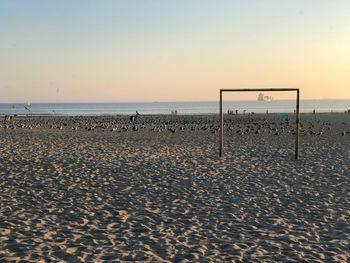 Scenic view of sea against clear sky during sunset