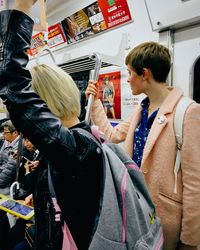 People traveling in subway train