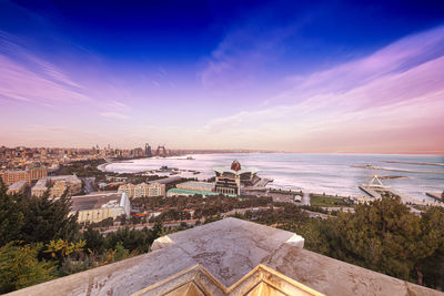 High angle view of buildings against sky during sunset