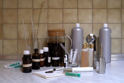 Medical equipment on table against wall at laboratory