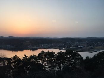 Scenic view of landscape against sky at sunset