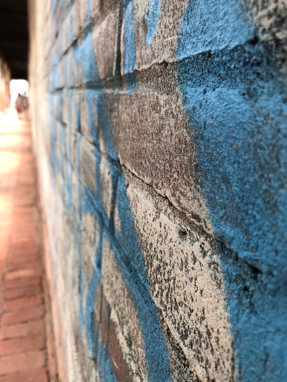 CLOSE-UP OF WALL WITH GRAFFITI