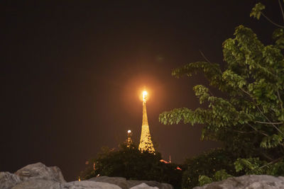 View of illuminated built structure against sky at night