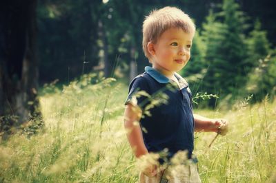 Cute baby boy playing in nature