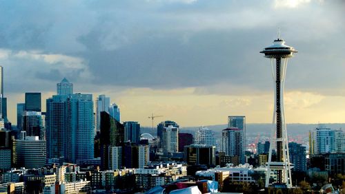 View of seattle skyline against cloudy sky