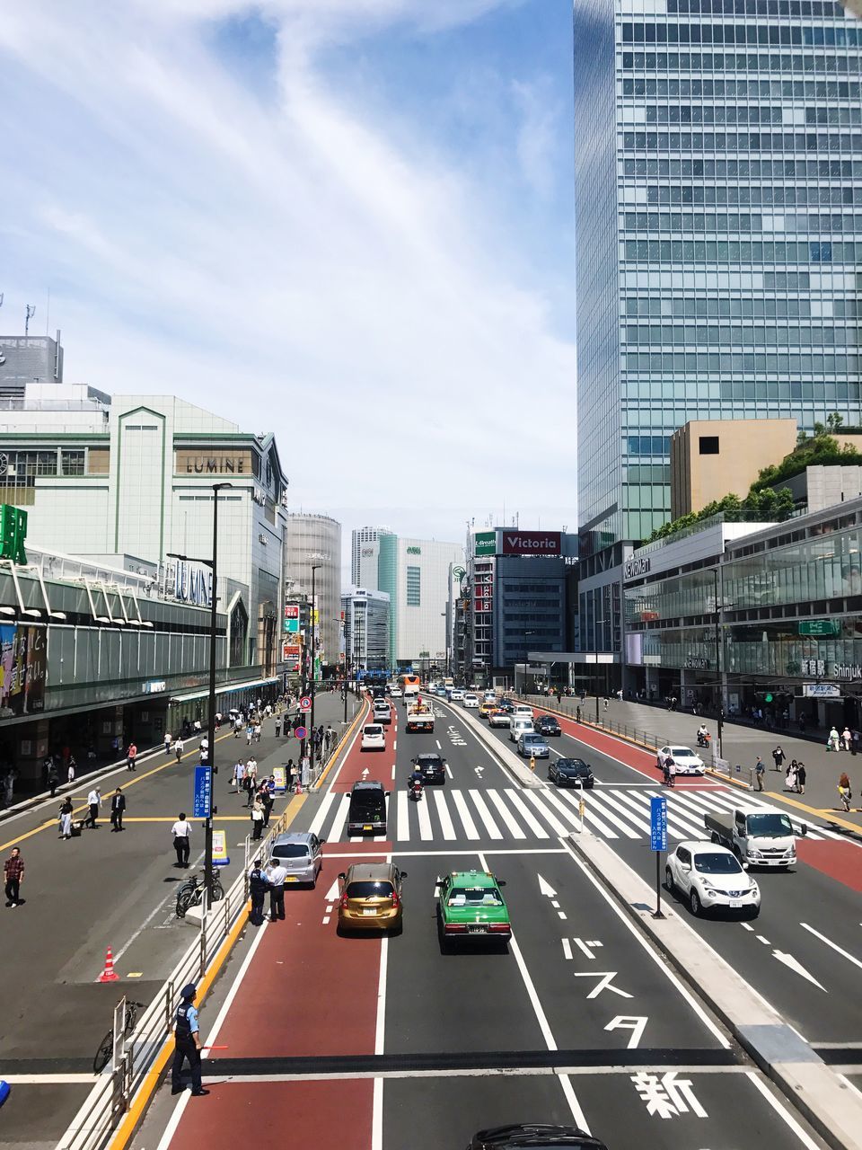 VEHICLES ON ROAD IN CITY