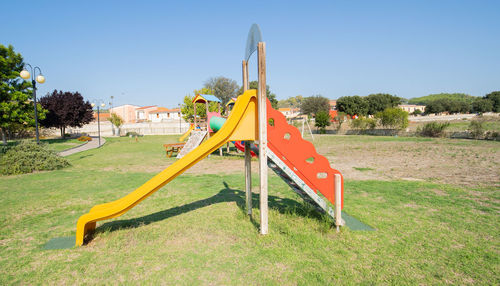 View of playground against clear sky