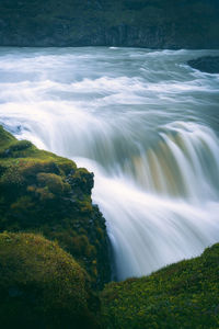 Closeup view of flowing water stream at gulfoss waterfall, golden circle iceland