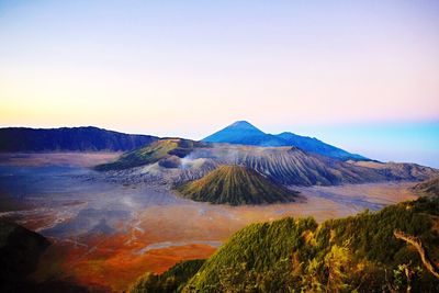 Scenic view of mountains against cloudy sky