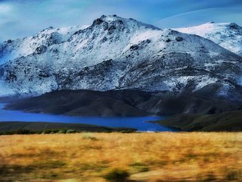 Scenic view of snowcapped mountains against sky