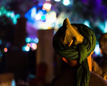 Low angle view of woman standing at night