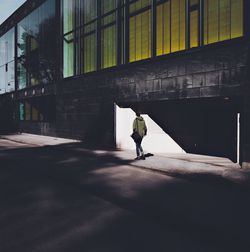 Full length of man walking in corridor of building