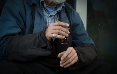 Close-up of man sitting outdoors