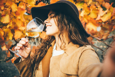 Young woman drinking glass