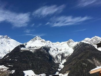 Scenic view of snowcapped mountains against clear sky