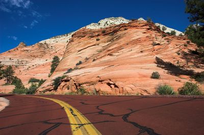 Scenic view of mountains against clear blue sky