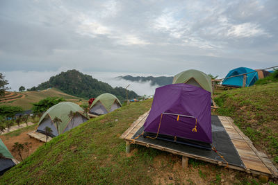 Tent on field against sky