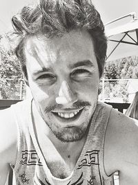 Close-up portrait of a smiling young man