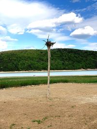 Windmill on field against sky