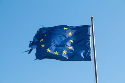 Low angle view of europe union flag against clear blue sky