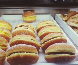 Close-up of cakes in for sale in display cabinet