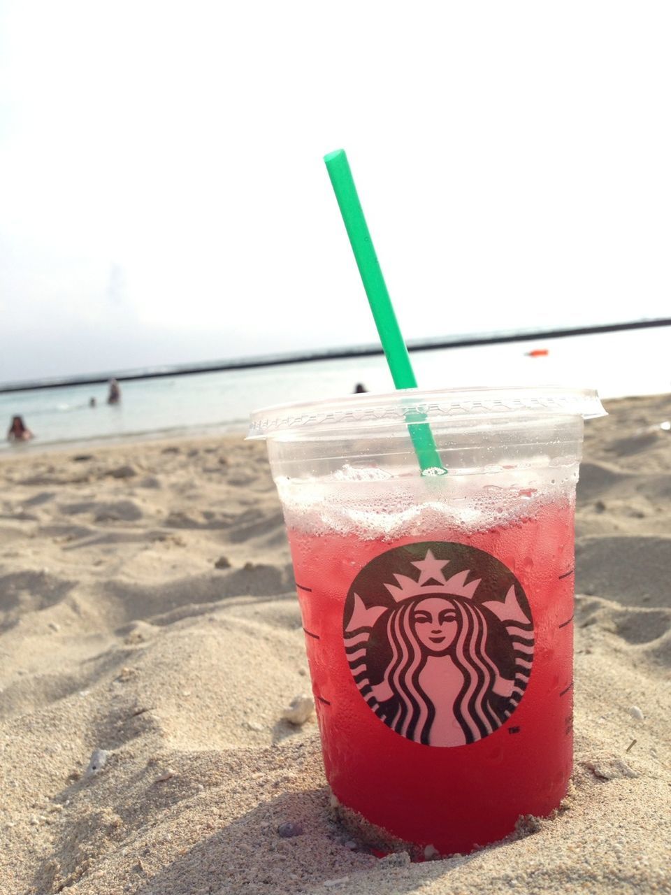 beach, sand, shore, horizon over water, sea, red, still life, copy space, table, water, absence, day, no people, clear sky, empty, wood - material, close-up, outdoors, plastic, food and drink