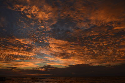 Scenic view of dramatic sky during sunset