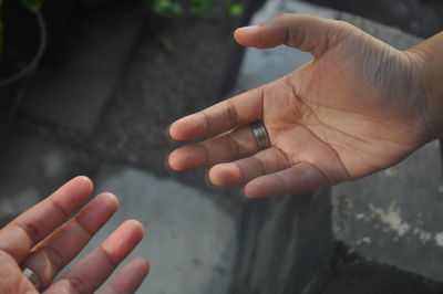 Close-up of man holding hands