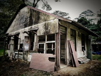 Abandoned building against sky